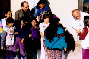 Frs.JoelAndStanWithChildrenAtPueblo.jpg (25704 bytes)